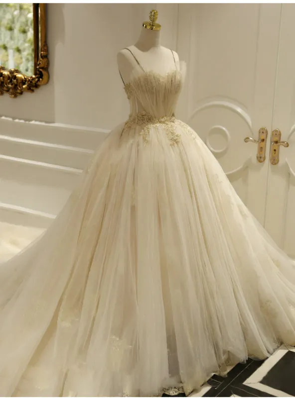 Champagne Ball Gown Tulle Spaghetti Straps Backless Wedding Dress