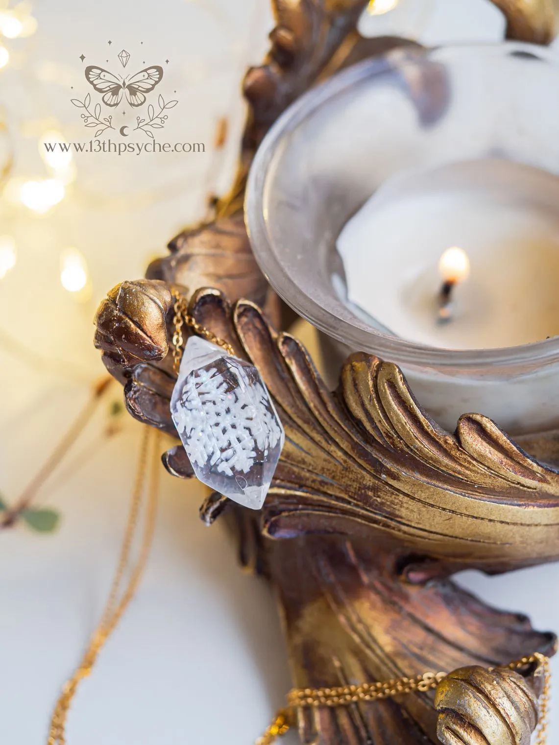 Encased snowflake crystal point pendant necklace