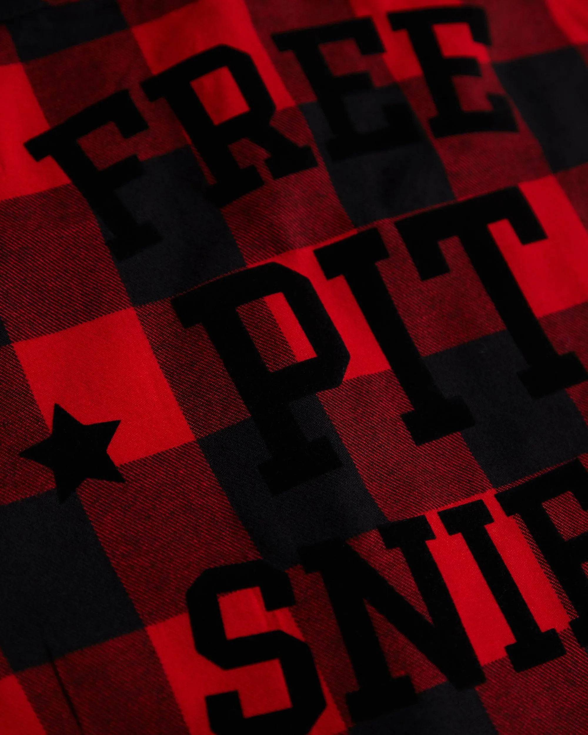 Free pits Sniff, black flock on sleeveless checked flannel shirt