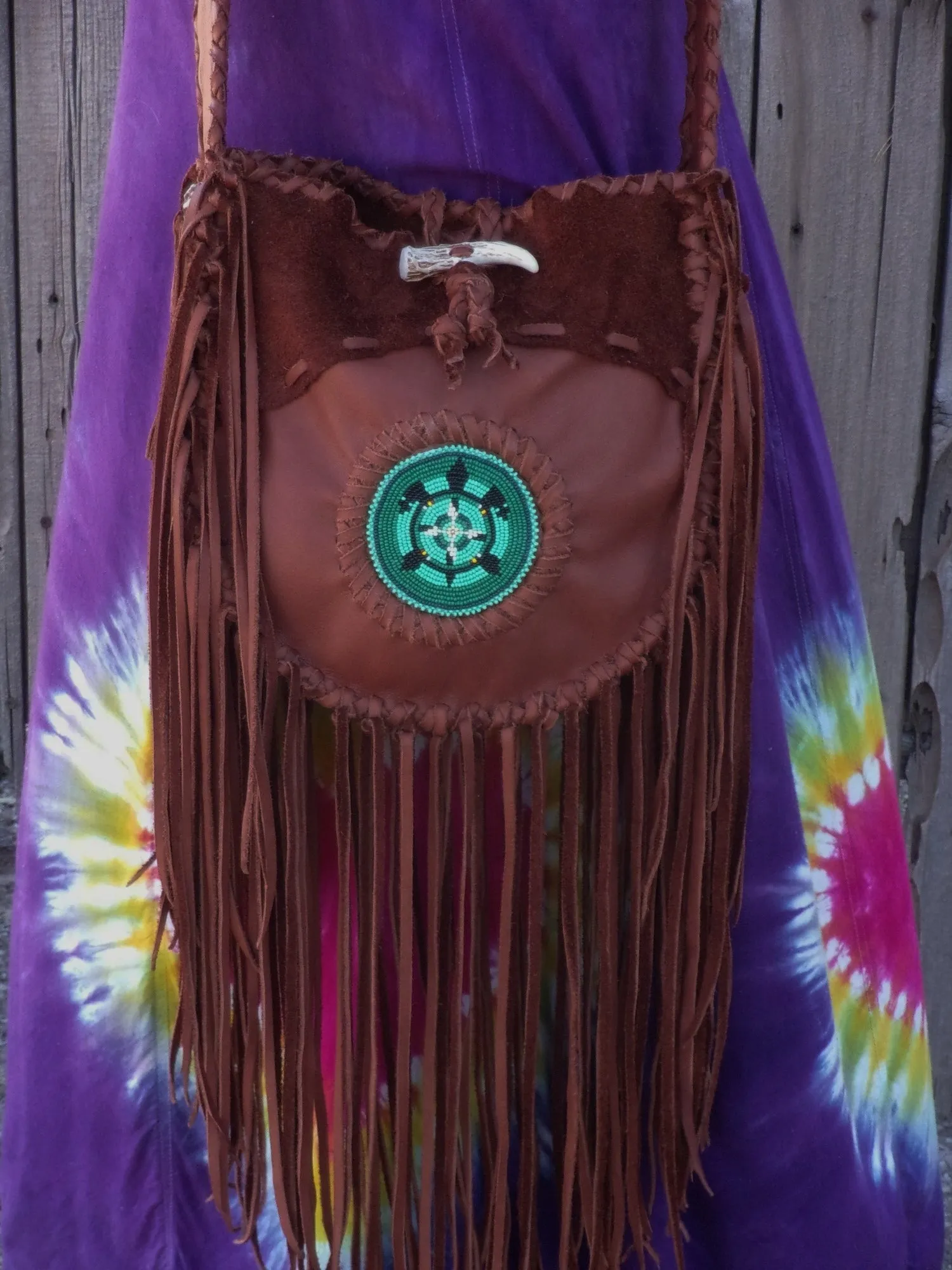 Fringed leather tote with beaded turtle