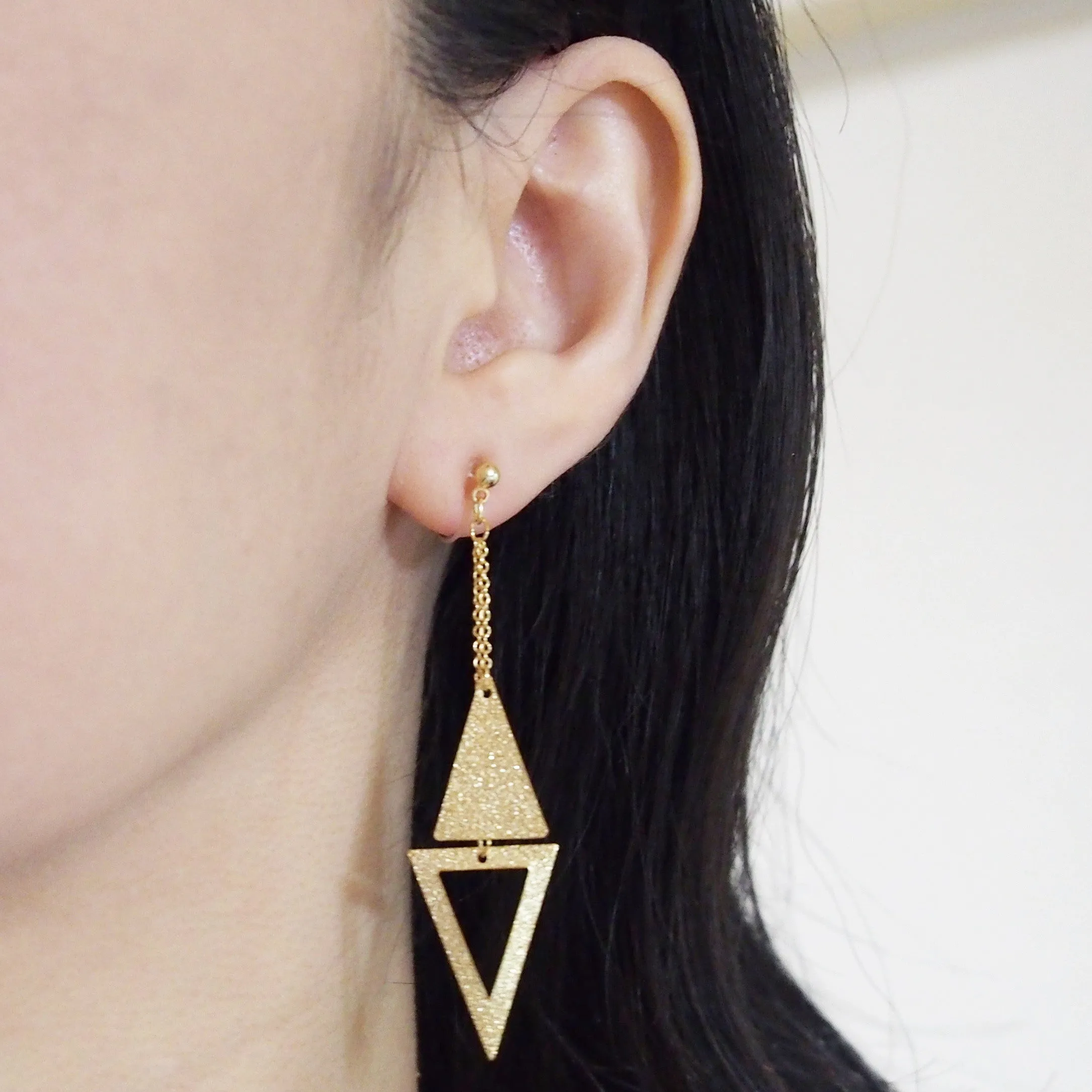 Metallic gold double triangle invisible clip on earrings