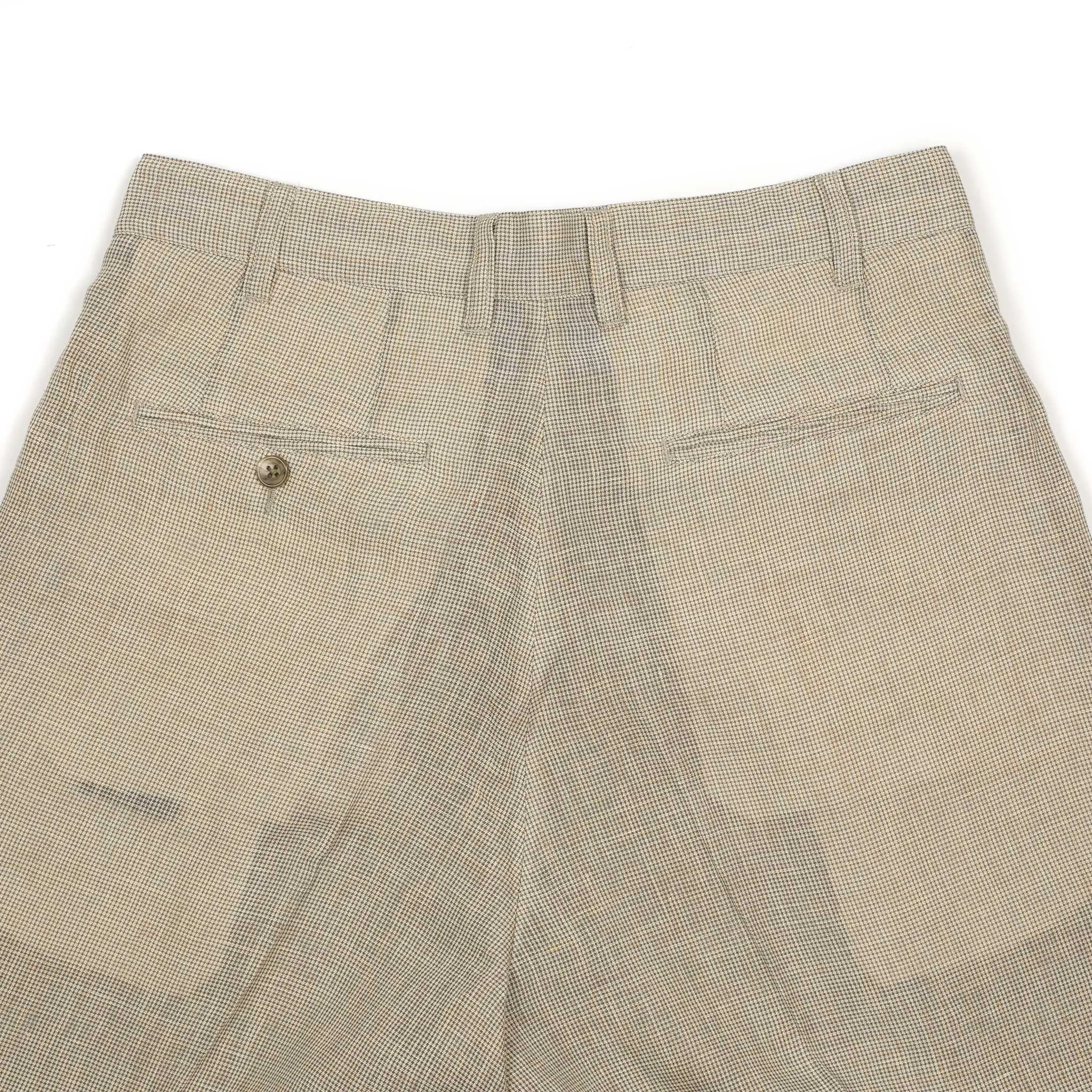 Pleated tapered trousers in ivory houndstooth linen and cupro