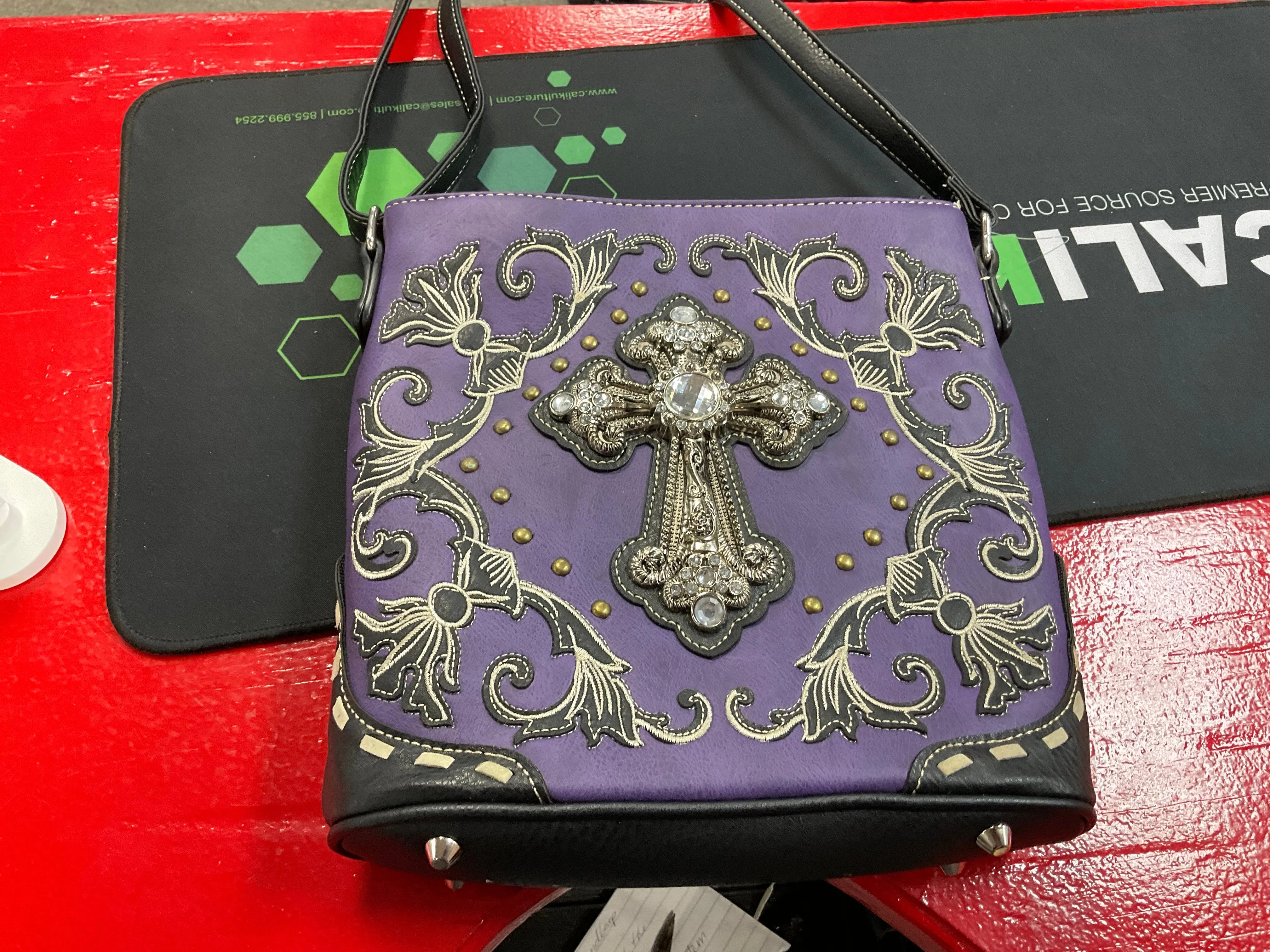 Purple and black cross satchel