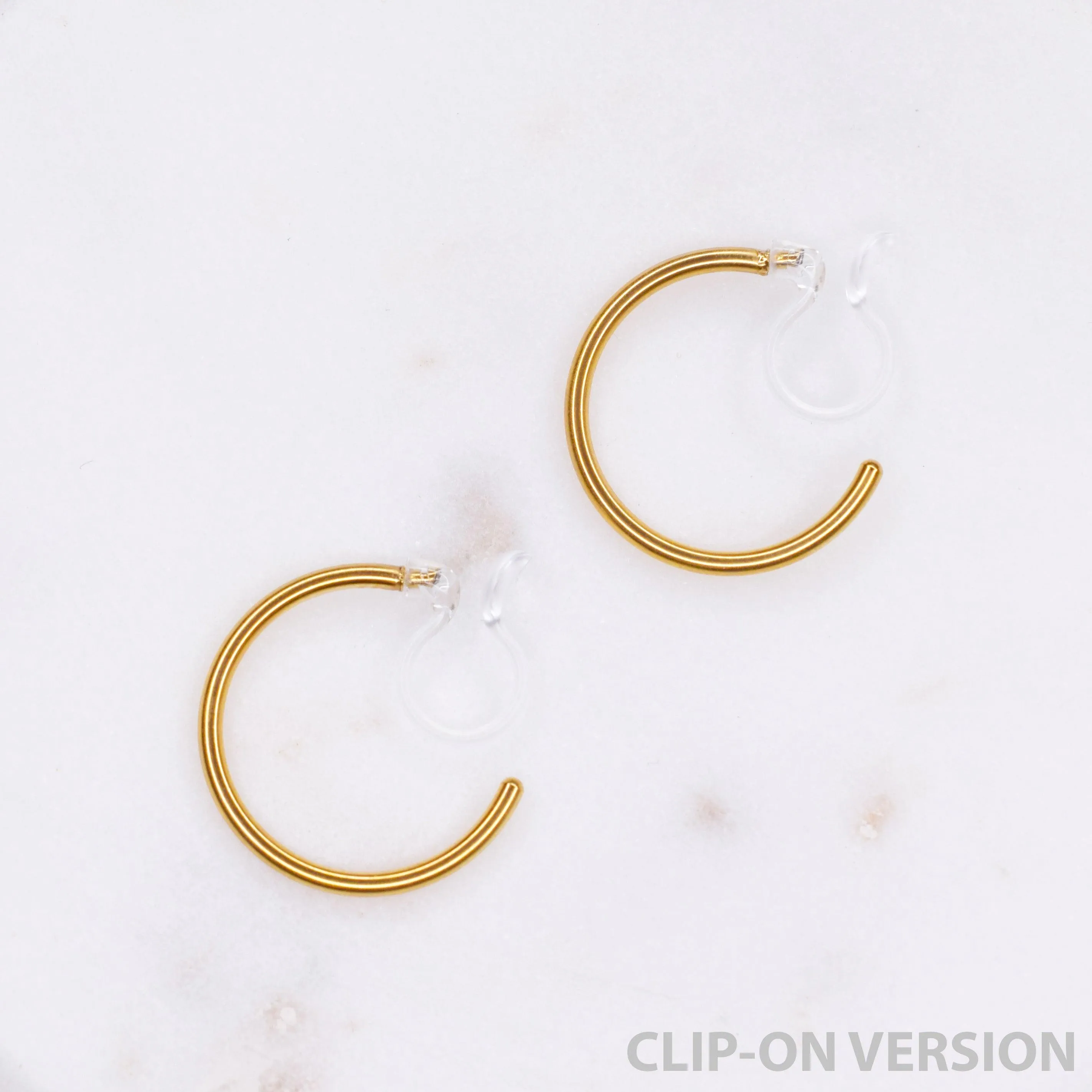 SMALL HOOP CLIP-ON EARRINGS IN GOLD