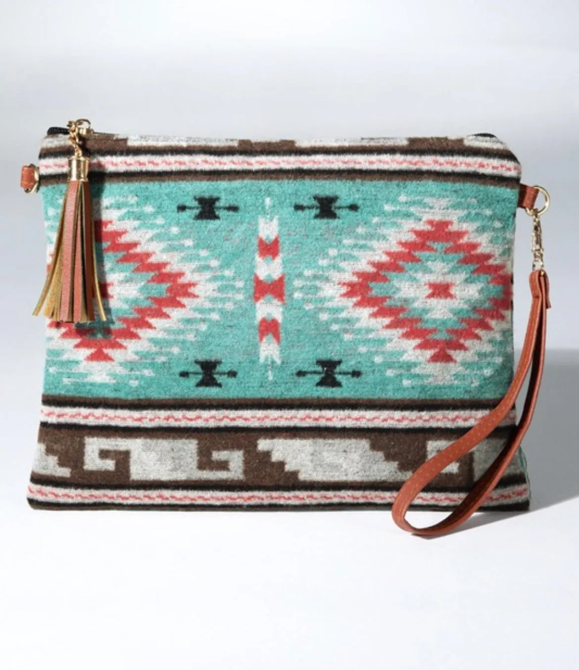 Turquoise western ethnic print with a detachable wristlet strap and tassel crossbody