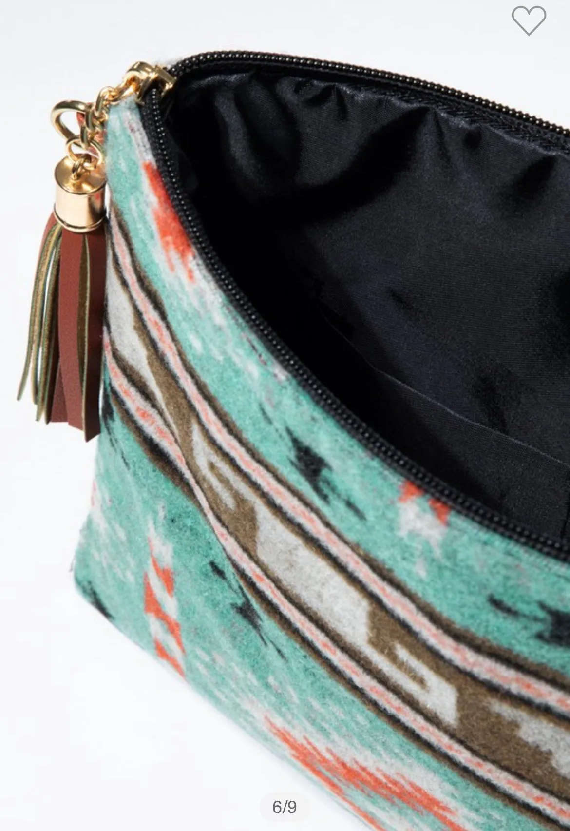 Turquoise western ethnic print with a detachable wristlet strap and tassel crossbody