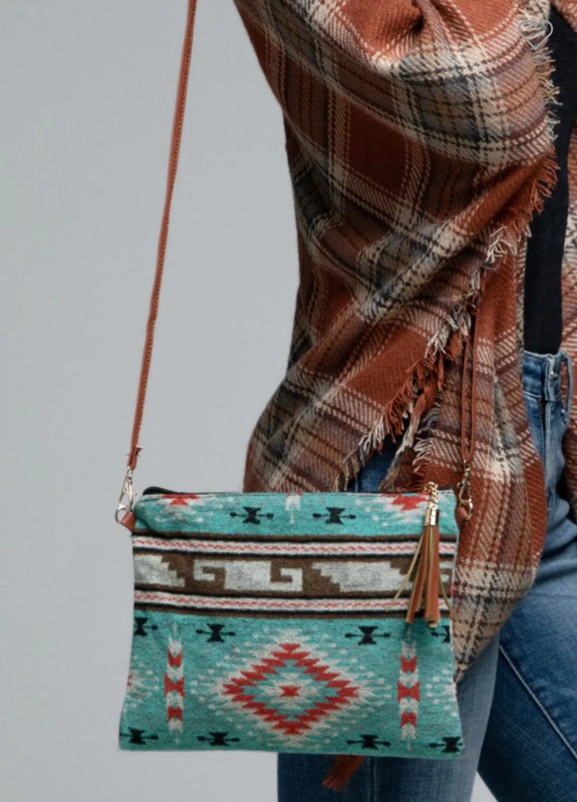 Turquoise western ethnic print with a detachable wristlet strap and tassel crossbody